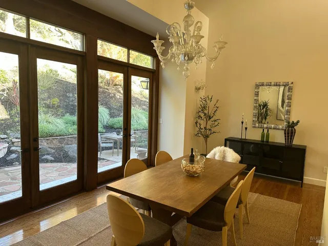 a workspace with wooden floor and a window