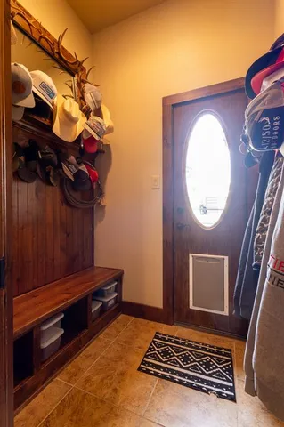 a view of room with a rug and white walls