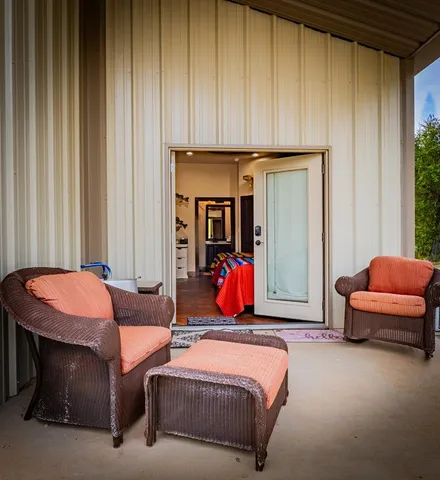 a bedroom with bed and a window
