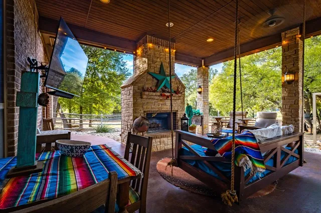 a view of living room filled with furniture and a rug