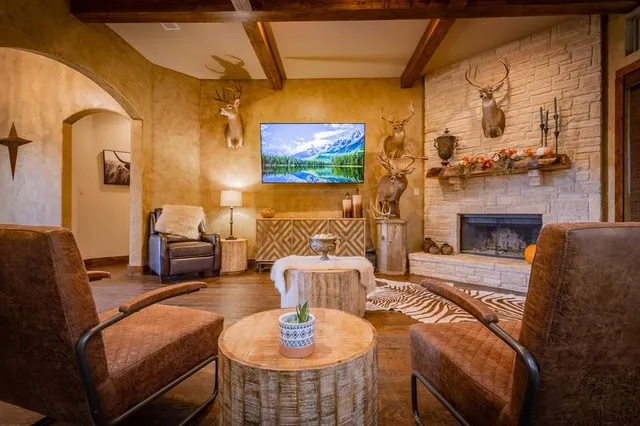 a living room with furniture and a fireplace