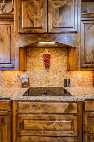 a bathroom with a granite countertop sink