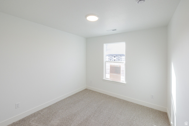 4769 Olive Avenue, Unit 411 Mapleton, UT 84664 - Photo 15 of 19 Unfurnished room featuring carpet flooring and baseboards