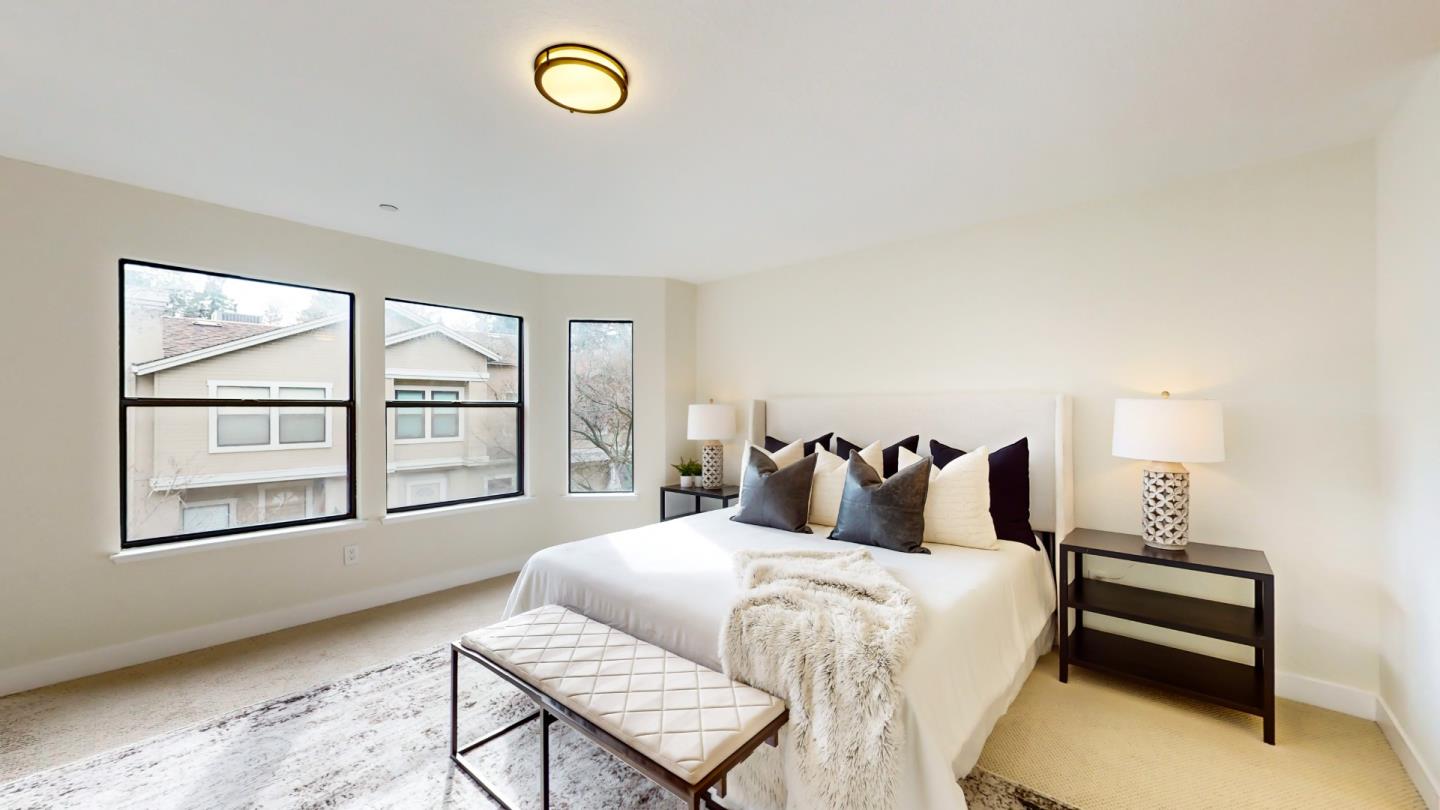 994 La Mesa Terrace, Unit E Sunnyvale, CA 94086 - Photo 11 of 28 a bedroom with a bed and a window
