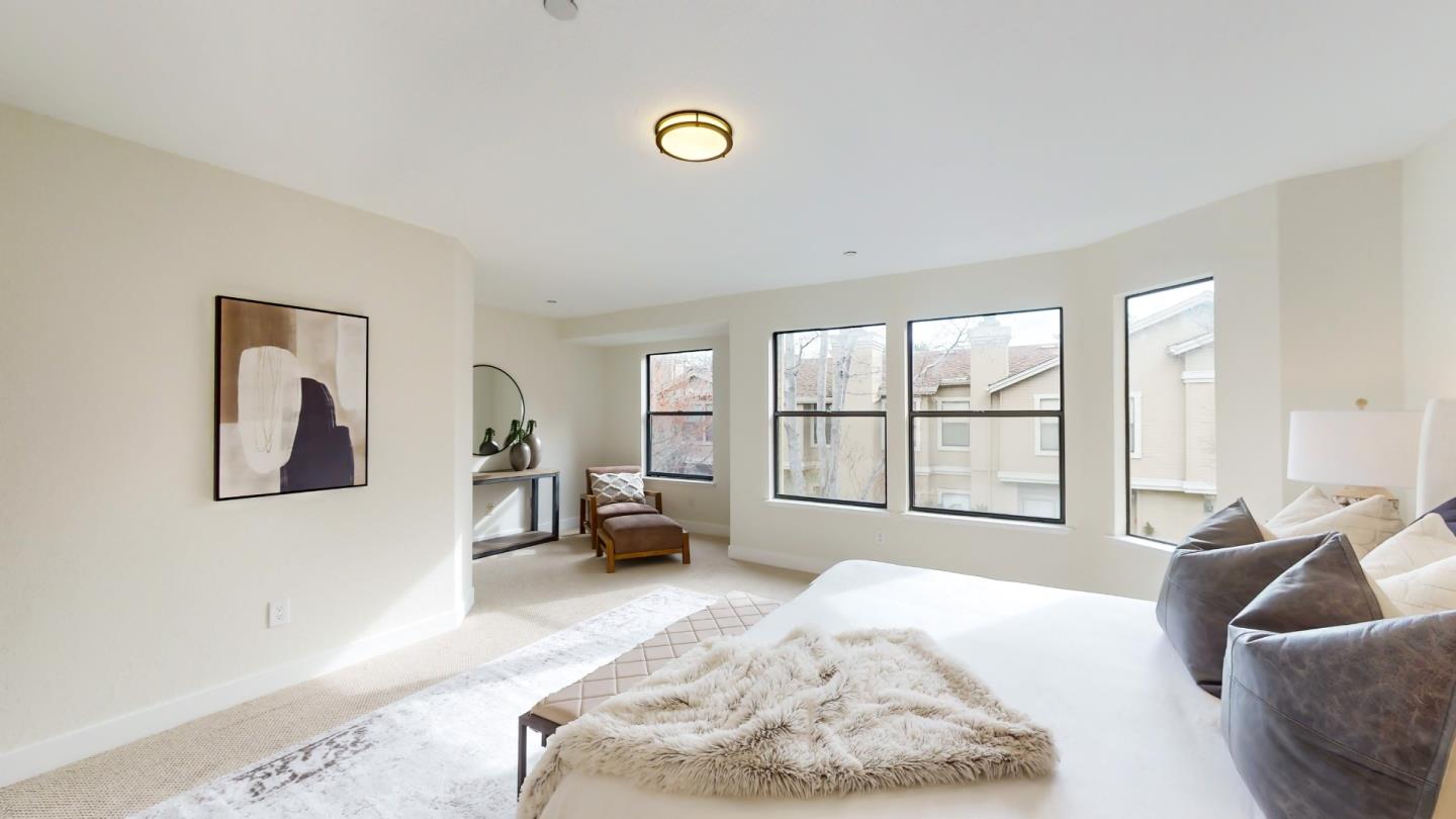 994 La Mesa Terrace, Unit E Sunnyvale, CA 94086 - Photo 12 of 28 a living room with furniture and a large window