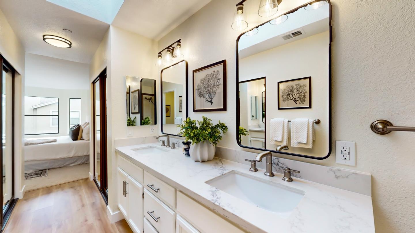 994 La Mesa Terrace, Unit E Sunnyvale, CA 94086 - Photo 14 of 28 a bathroom with double vanity sinks and a glass door shower