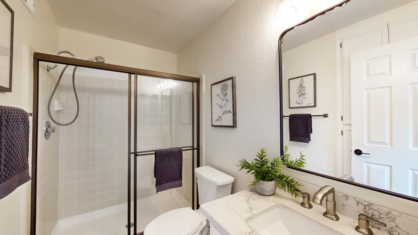 994 La Mesa Terrace, Unit E Sunnyvale, CA 94086 - Photo 18 of 28 a bathroom with a granite countertop shower sink vanity mirror and toilet