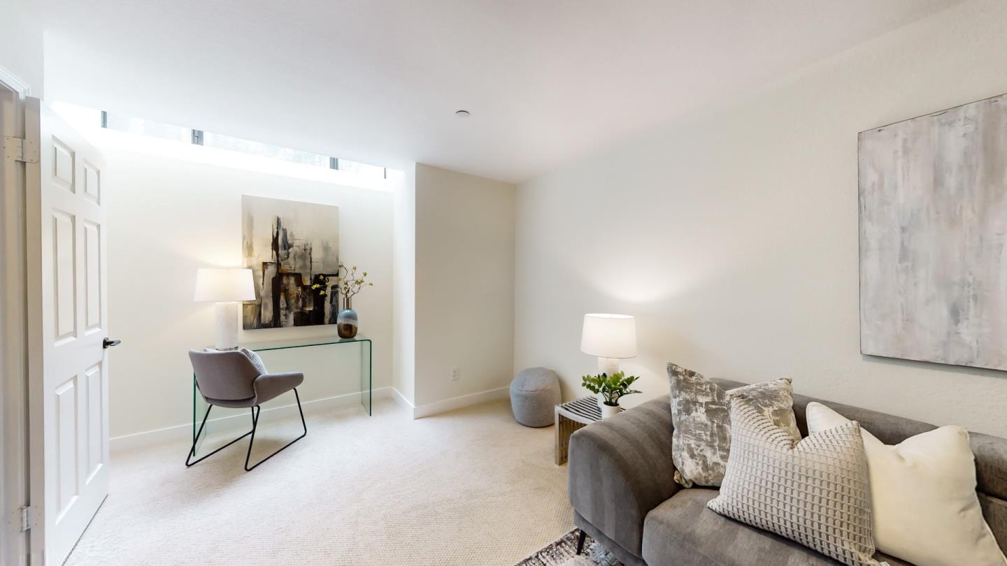 994 La Mesa Terrace, Unit E Sunnyvale, CA 94086 - Photo 19 of 28 a living room with furniture and a painting on the wall