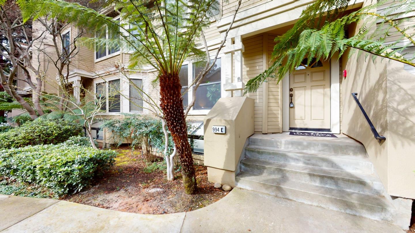 994 La Mesa Terrace, Unit E Sunnyvale, CA 94086 - Photo 25 of 28 a front view of a house with a yard