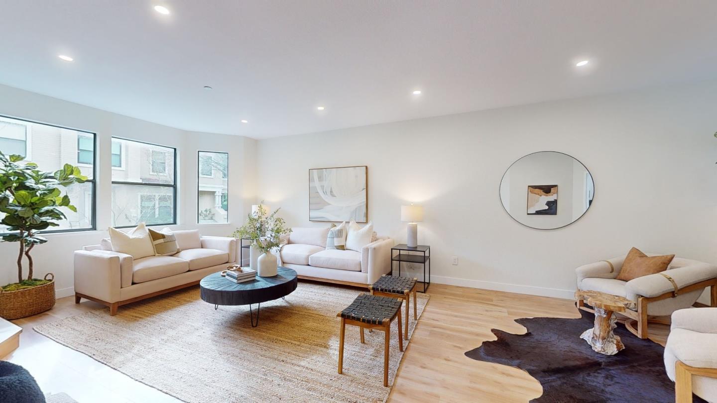 994 La Mesa Terrace, Unit E Sunnyvale, CA 94086 - Photo 3 of 28 a living room with furniture rug and window