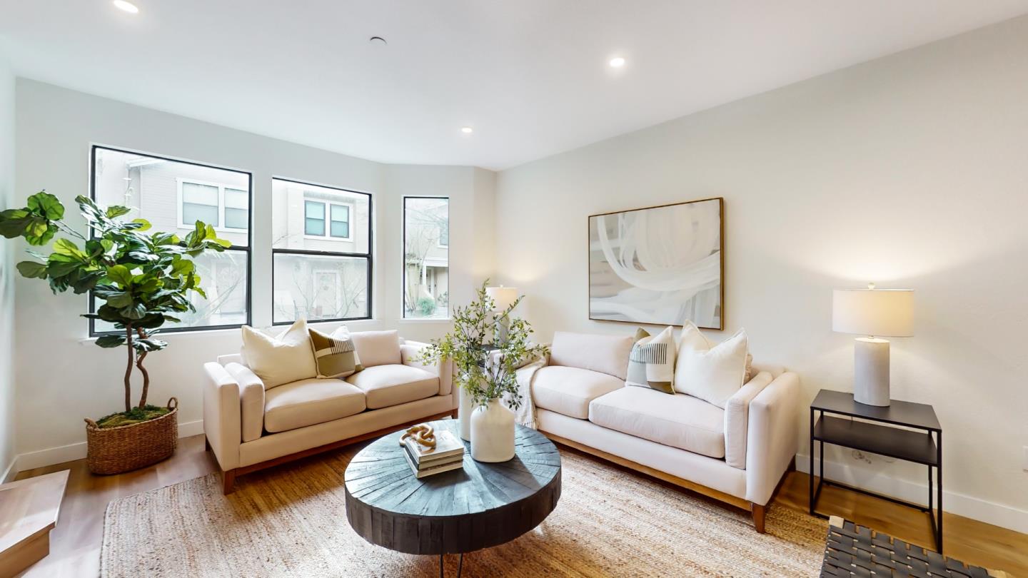 994 La Mesa Terrace, Unit E Sunnyvale, CA 94086 - Photo 4 of 28 a living room with furniture and a potted plant