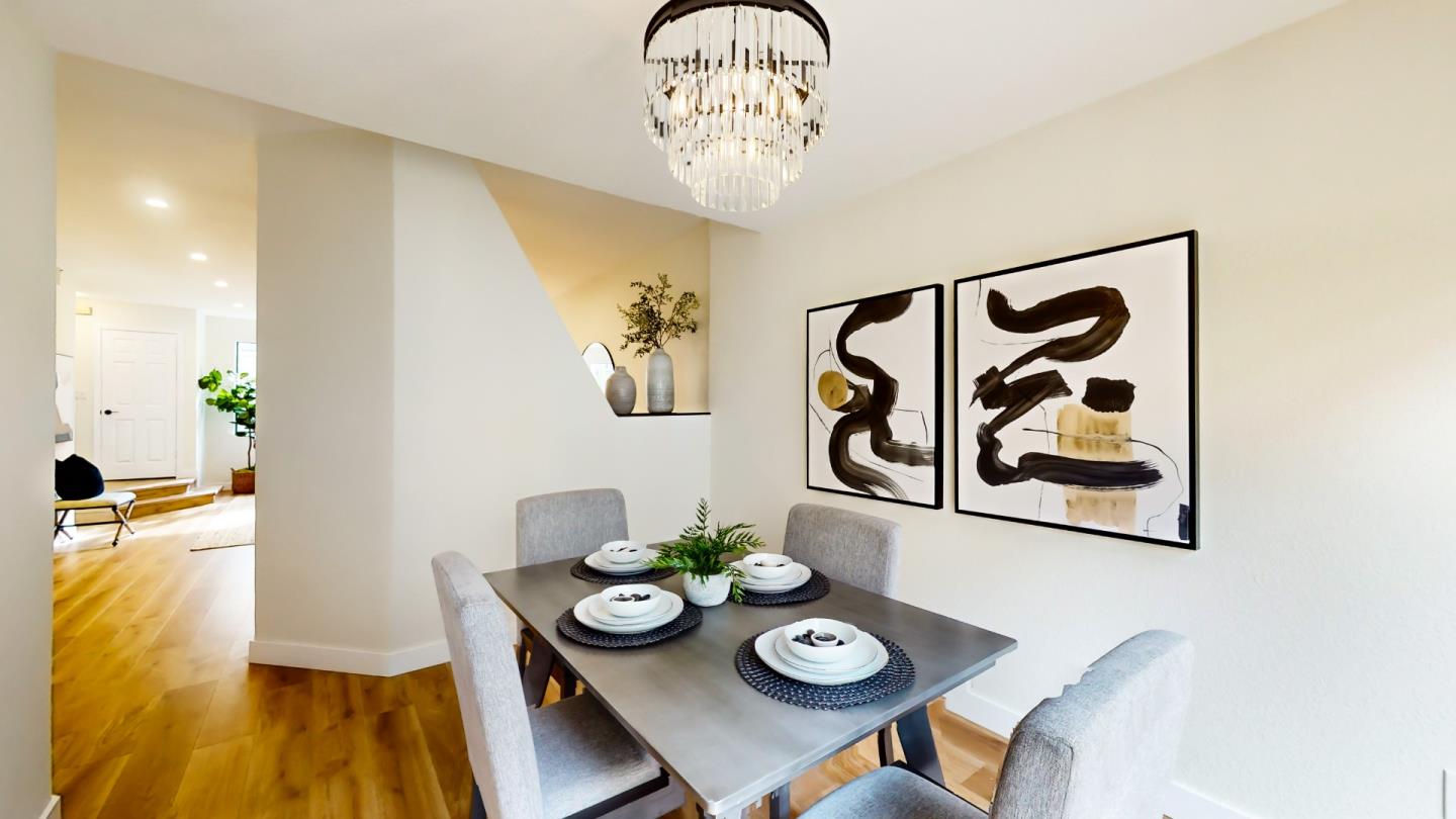 994 La Mesa Terrace, Unit E Sunnyvale, CA 94086 - Photo 6 of 28 a view of a dining room with furniture and wooden floor