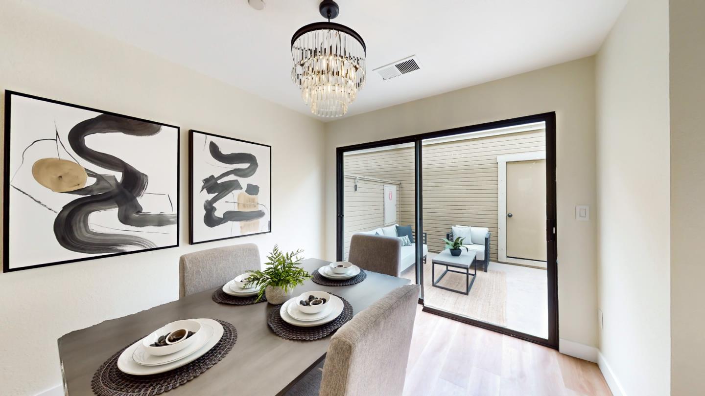 994 La Mesa Terrace, Unit E Sunnyvale, CA 94086 - Photo 7 of 28 a view of a dining room with furniture chandelier and wooden floor