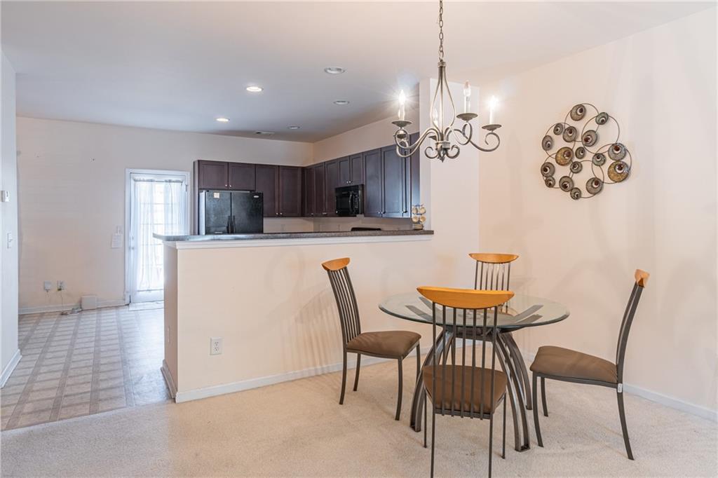2182 Hyssop Way Buford, GA 30519 - Photo 4 of 16 a view of a dining room with furniture