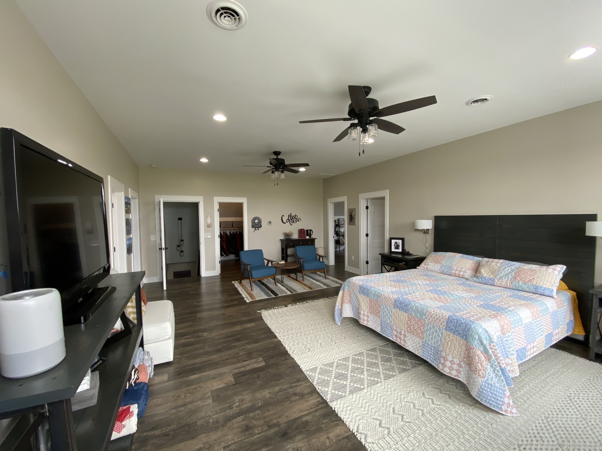 1259 Martin Road Morrison, TN 37357 - Photo 31 of 68 a spacious bedroom with a bed a couch and a chandelier