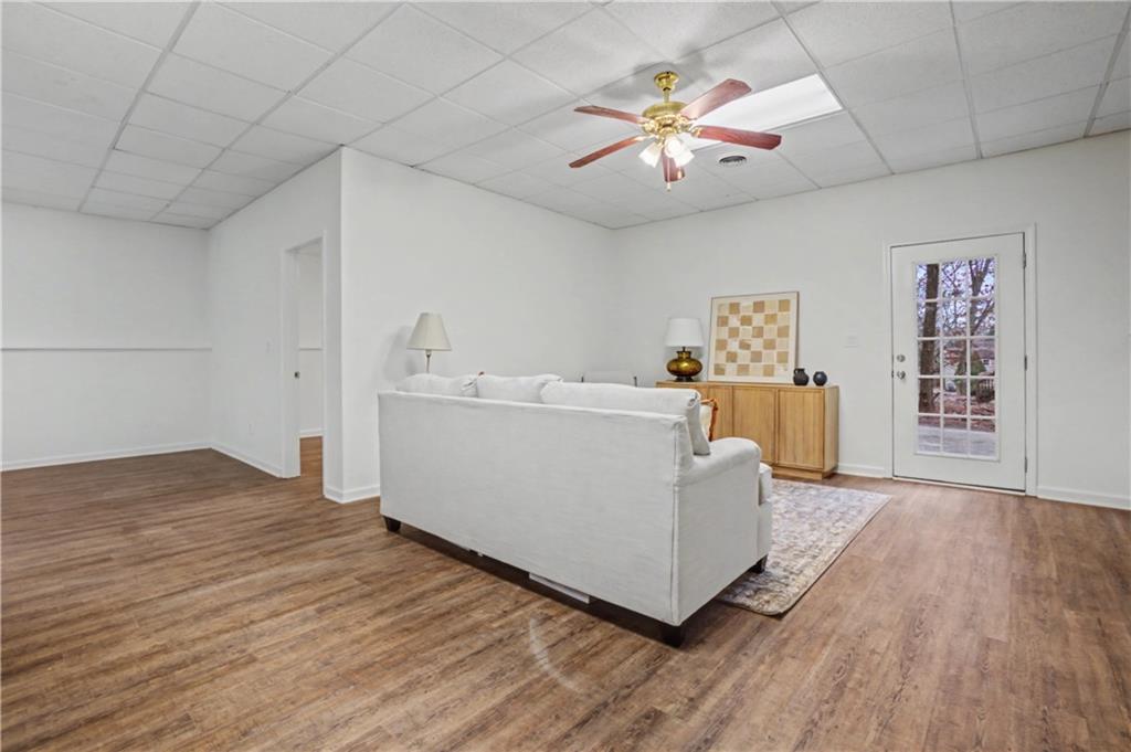 520 Victoria Road Woodstock, GA 30189 - Photo 26 of 42 a living room with furniture and a chandelier