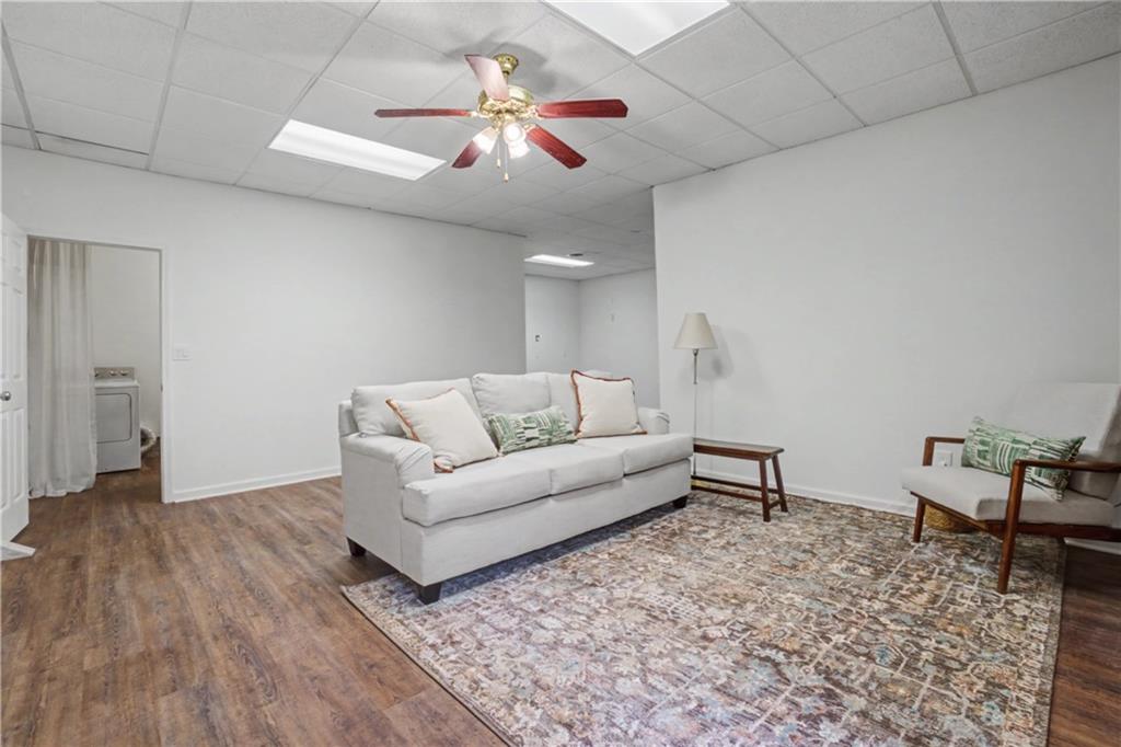 520 Victoria Road Woodstock, GA 30189 - Photo 27 of 42 a living room with furniture and a ceiling fan