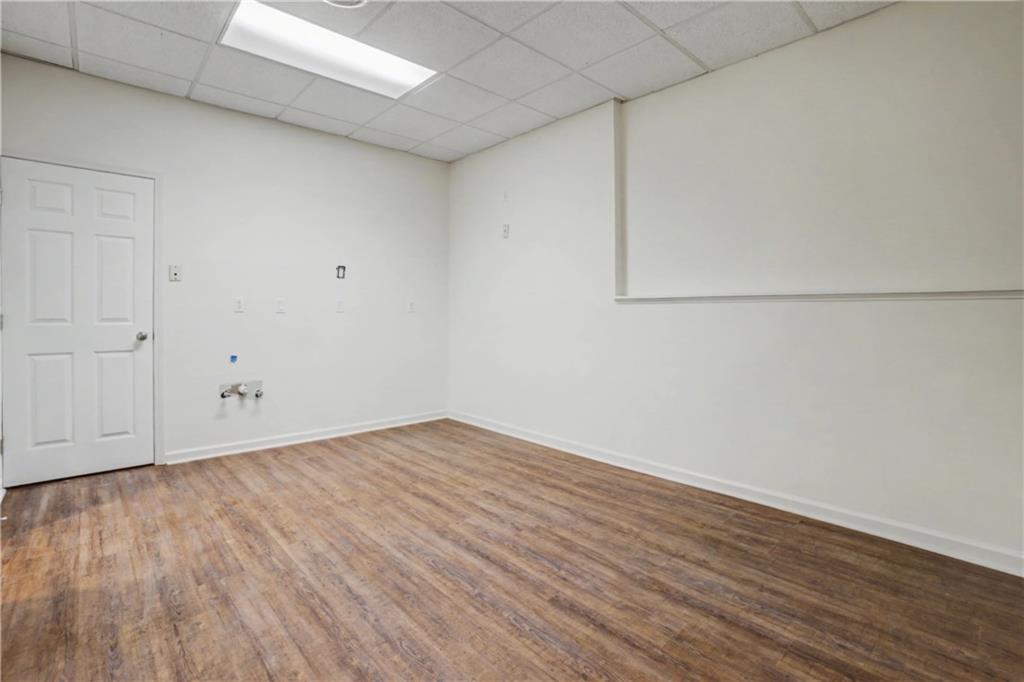 520 Victoria Road Woodstock, GA 30189 - Photo 30 of 42 a view of an empty room with wooden floor