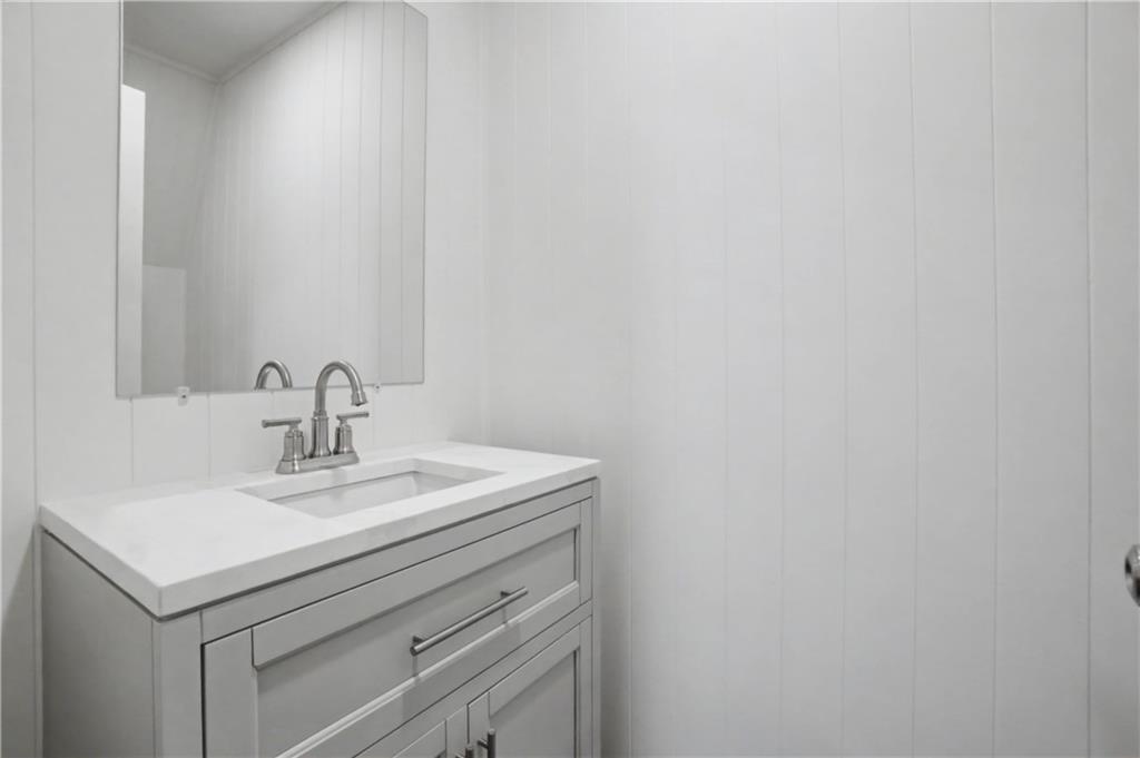 520 Victoria Road Woodstock, GA 30189 - Photo 31 of 42 a close up of a sink and a mirror