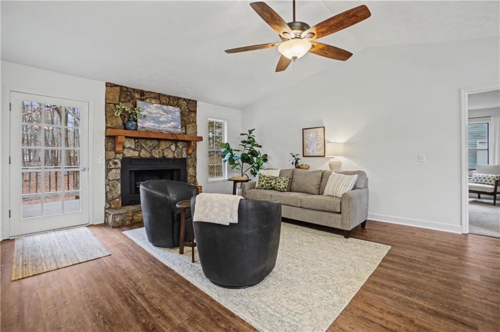 520 Victoria Road Woodstock, GA 30189 - Photo 6 of 42 a living room with furniture and a fireplace