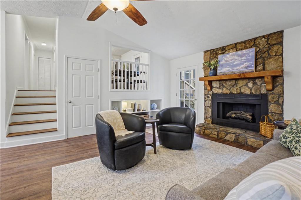 520 Victoria Road Woodstock, GA 30189 - Photo 8 of 42 a living room with furniture and a fireplace