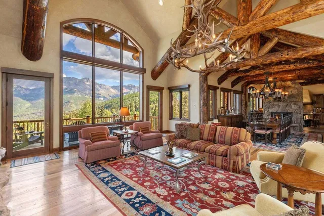 a living room with furniture or outdoor view and a large window