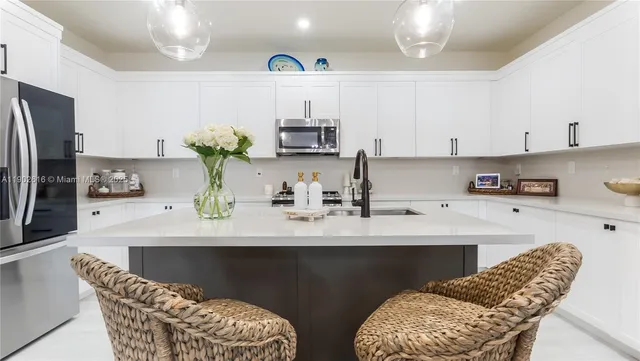 a view of bathroom with a potted plant in front of it