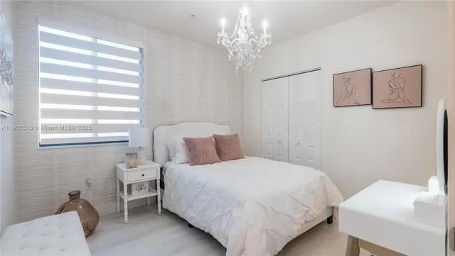 a kitchen with a table chairs stove and cabinets
