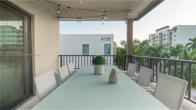 a white tub sitting next to a white toilet