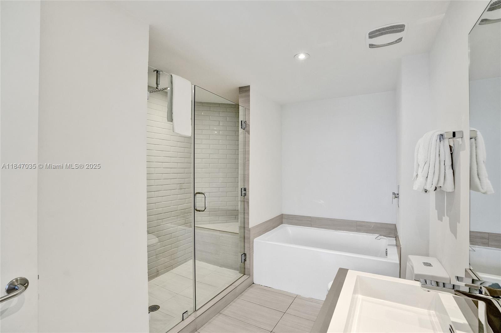 4010 South Ocean Drive, Unit R908 Hollywood, FL 33019 - Photo 18 of 53 a bathroom with a tub and shower