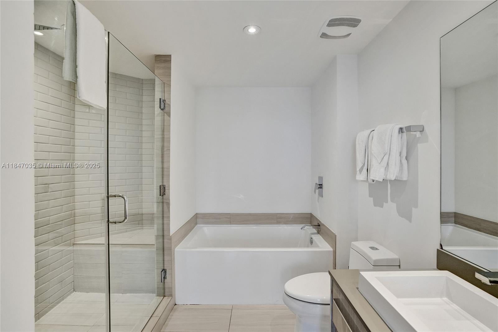 4010 South Ocean Drive, Unit R908 Hollywood, FL 33019 - Photo 19 of 53 a bathroom with a toilet a sink and bathtub