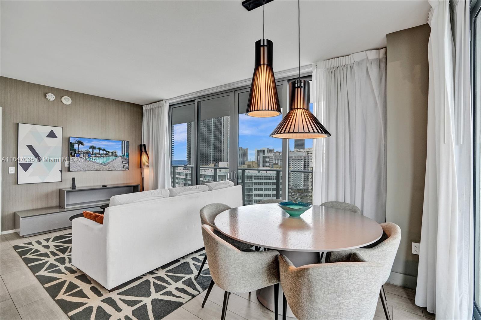 4010 South Ocean Drive, Unit R908 Hollywood, FL 33019 - Photo 5 of 53 a dining room with furniture and window