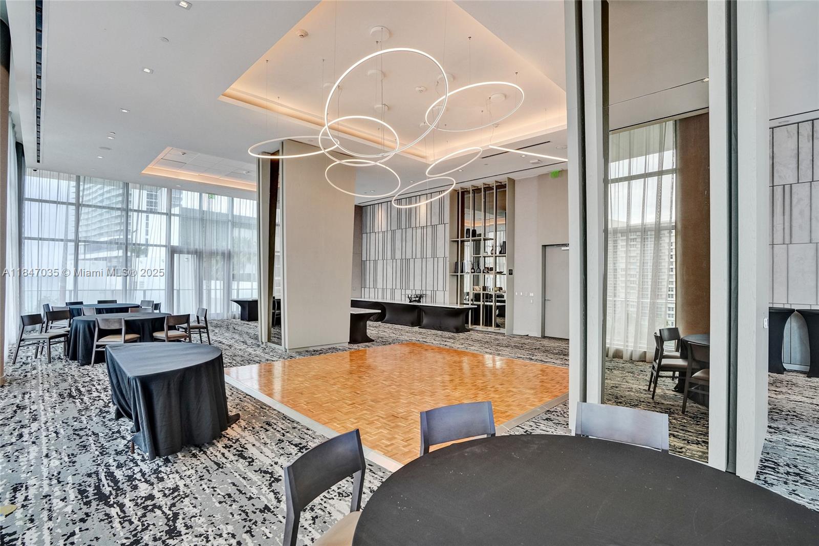 4010 South Ocean Drive, Unit R908 Hollywood, FL 33019 - Photo 53 of 53 a large bedroom with furniture and a large window