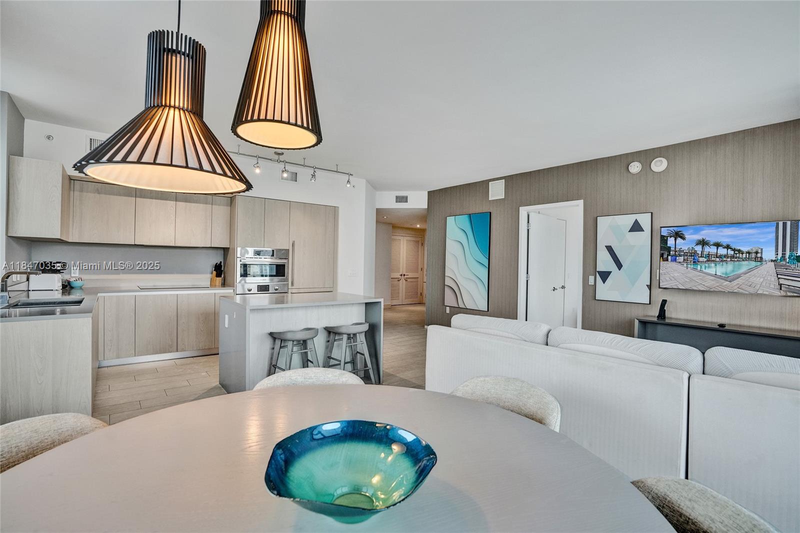 4010 South Ocean Drive, Unit R908 Hollywood, FL 33019 - Photo 6 of 53 a living room with furniture a rug and white walls