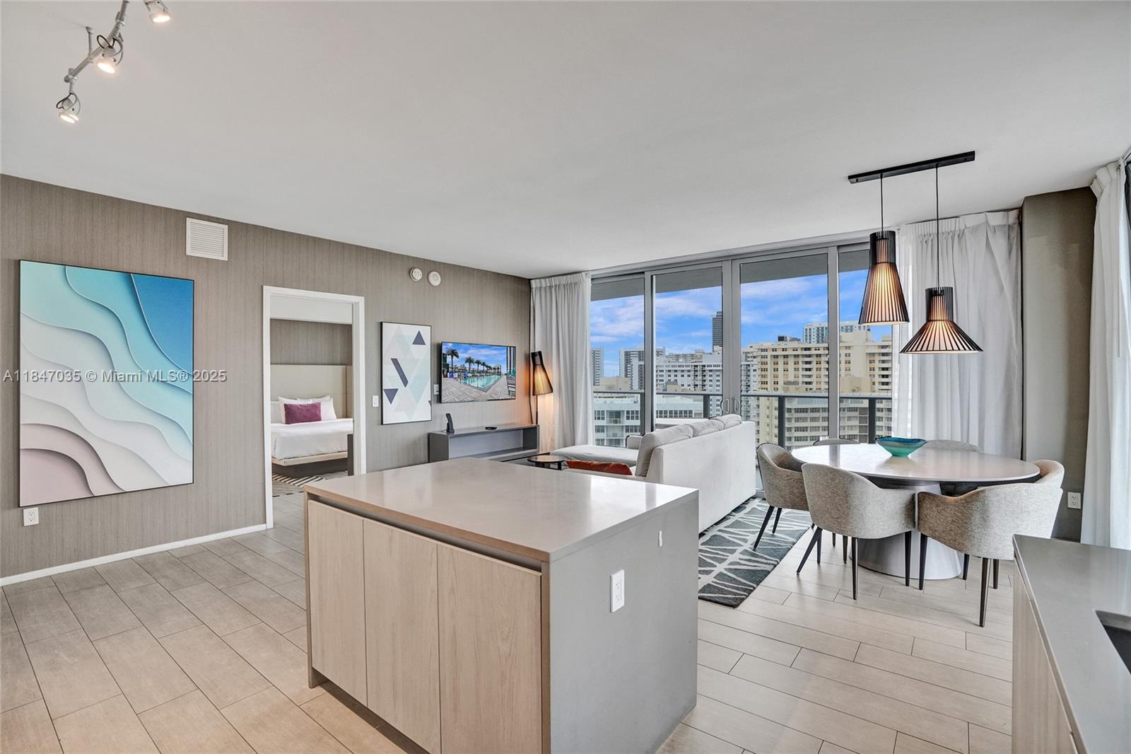 4010 South Ocean Drive, Unit R908 Hollywood, FL 33019 - Photo 9 of 53 a kitchen with a sink a counter top space and living room view
