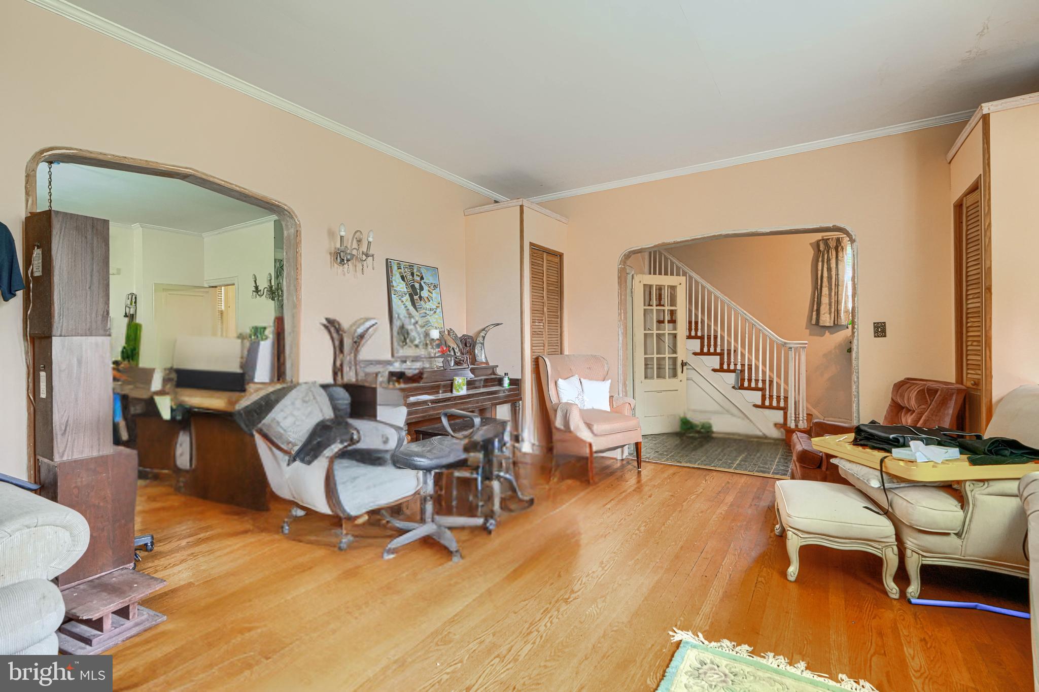 3212 Dorchester Road Baltimore, MD 21215 - Photo 13 of 45 a living room with fireplace furniture and a wooden floor