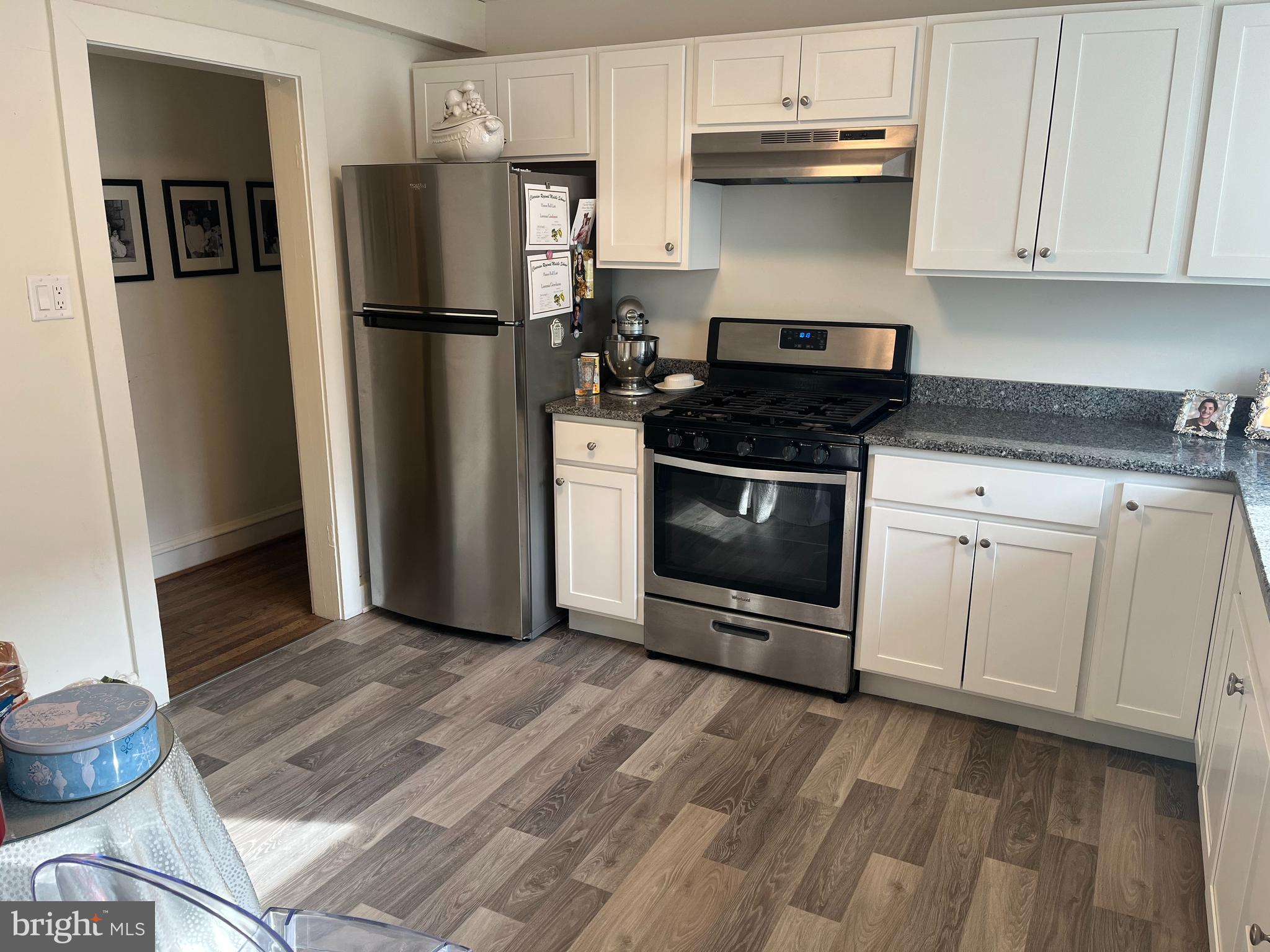38 South Main Street, Unit 3 Mullica Hill, NJ 08062 - Photo 9 of 10 a kitchen with a refrigerator stove and cabinets