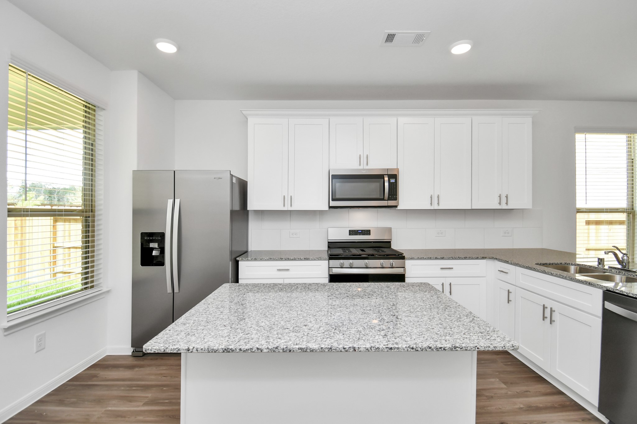 16150 Elbridge Court Conroe, TX 77302 - Photo 8 of 46 Kitchen featuring island and plenty of cabinet space.