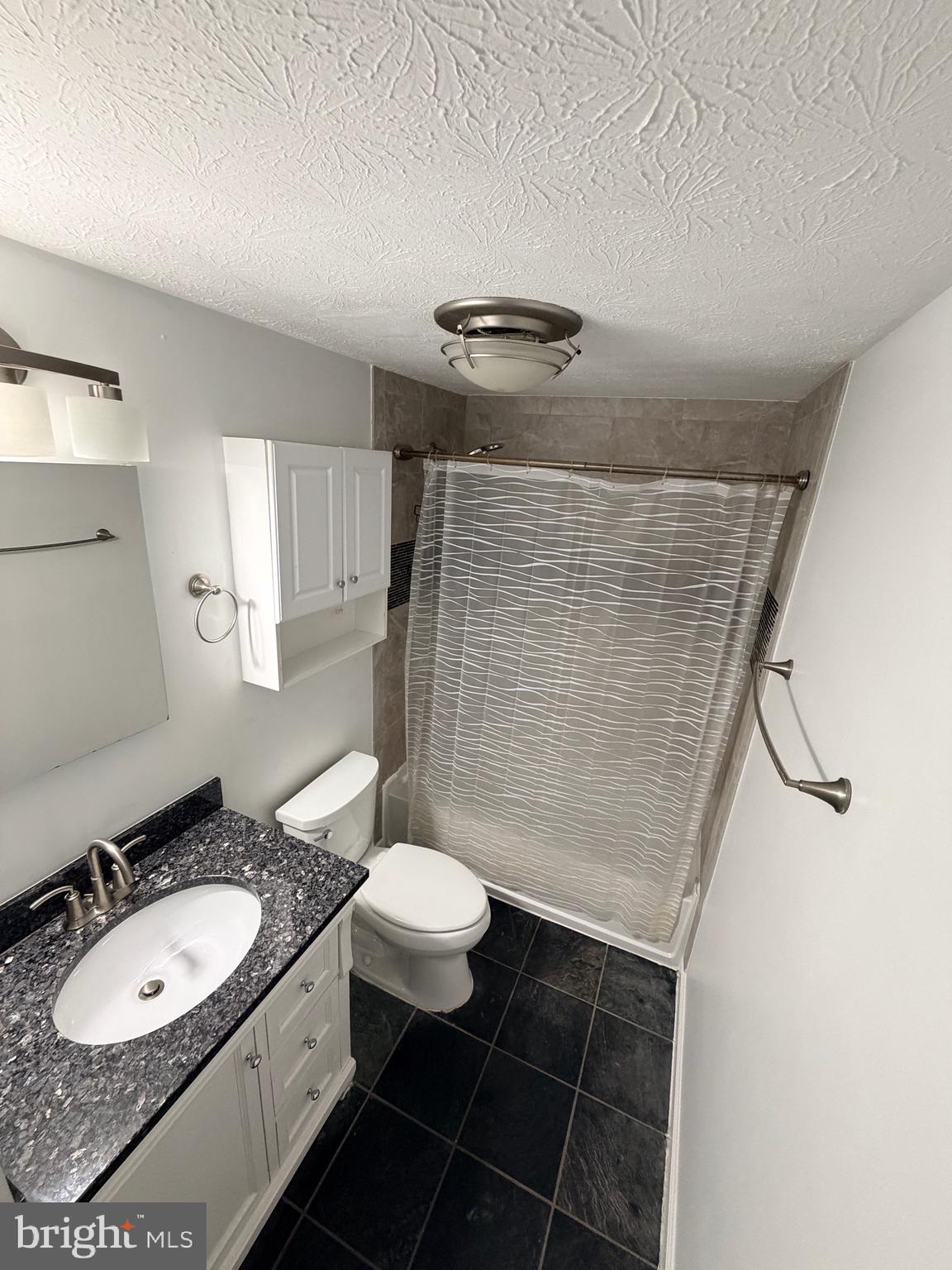 13953 Winding Ridge Lane Centreville, VA 20121 - Photo 11 of 23 a bathroom with a sink toilet and shower