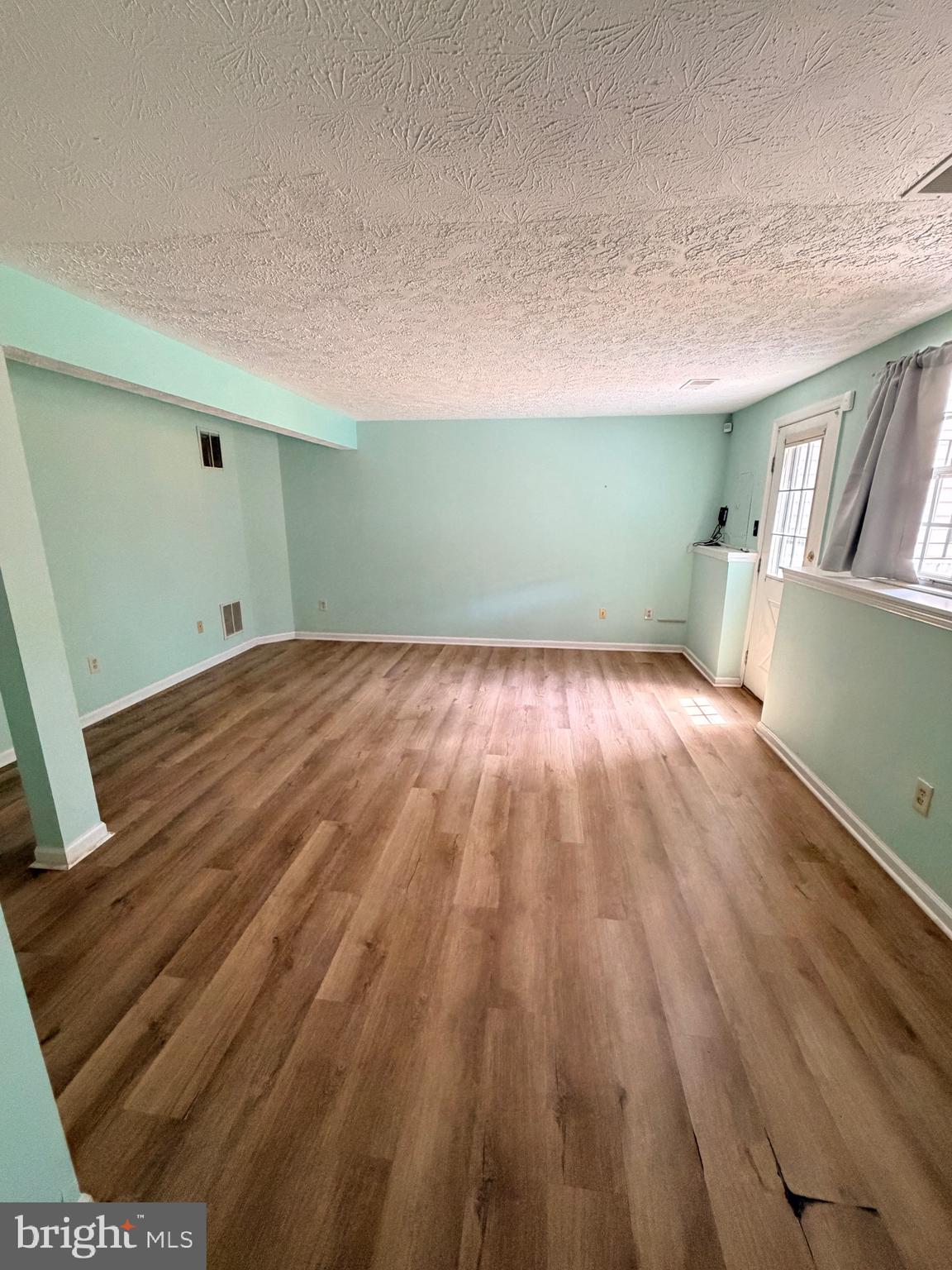 13953 Winding Ridge Lane Centreville, VA 20121 - Photo 16 of 23 a view of a room with wooden floor and a sink