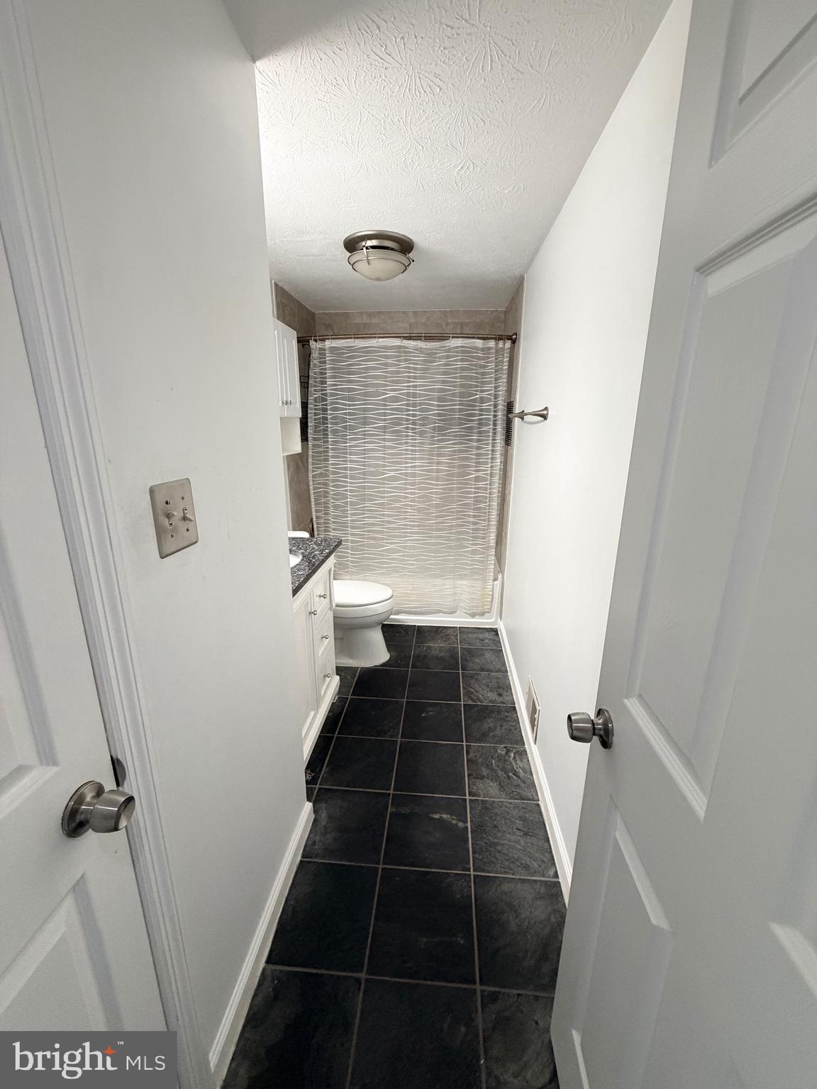 13953 Winding Ridge Lane Centreville, VA 20121 - Photo 10 of 23 a bathroom with a sink and a shower