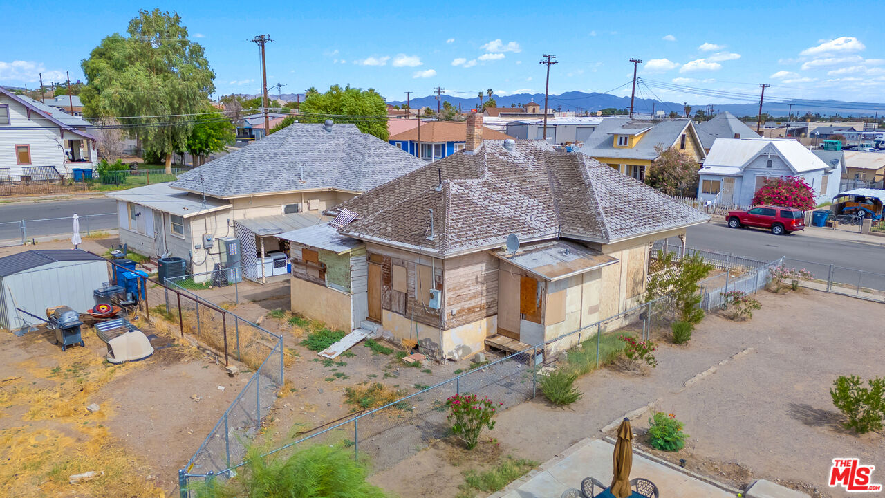 419 Acoma Street Needles, CA 92363 - Photo 15 of 29 an aerial view of a house with a yard and sitting area