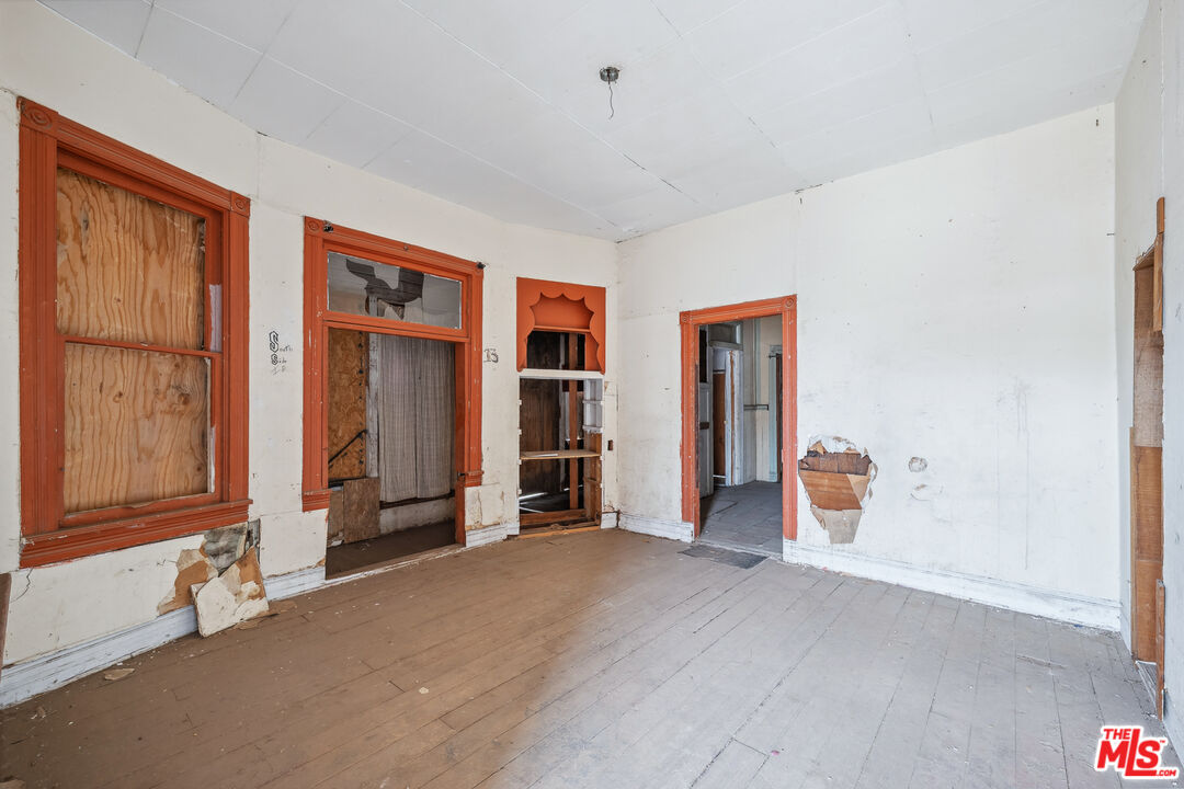 419 Acoma Street Needles, CA 92363 - Photo 20 of 29 a view of an empty room with workspace and a window