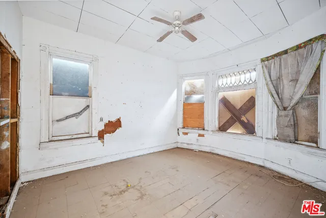 a view of a room with large windows