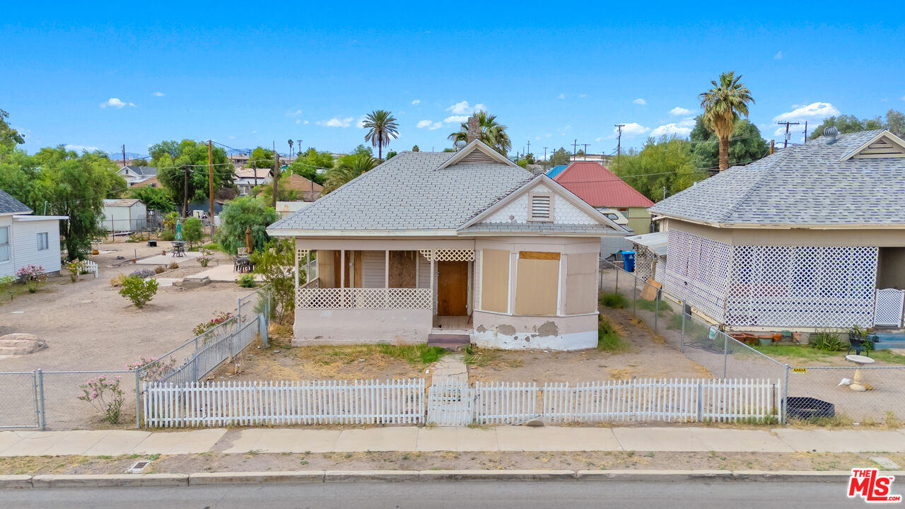 419 Acoma Street Needles, CA 92363 - Photo 10 of 29 a front view of a house with a yard