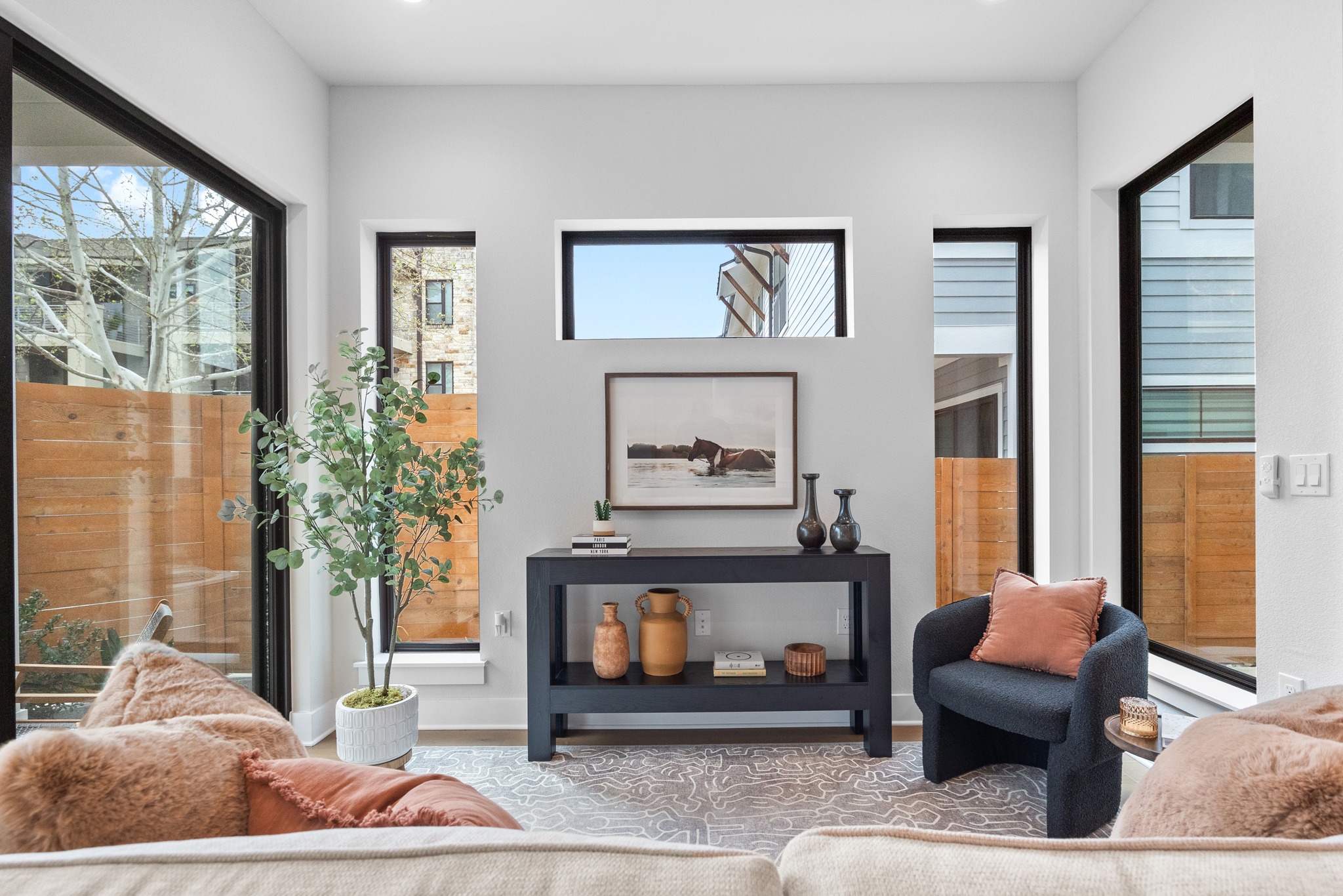 2707 Dulce Lane, Unit 14 Austin, TX 78704 - Photo 4 of 40 a living room with furniture and a fireplace