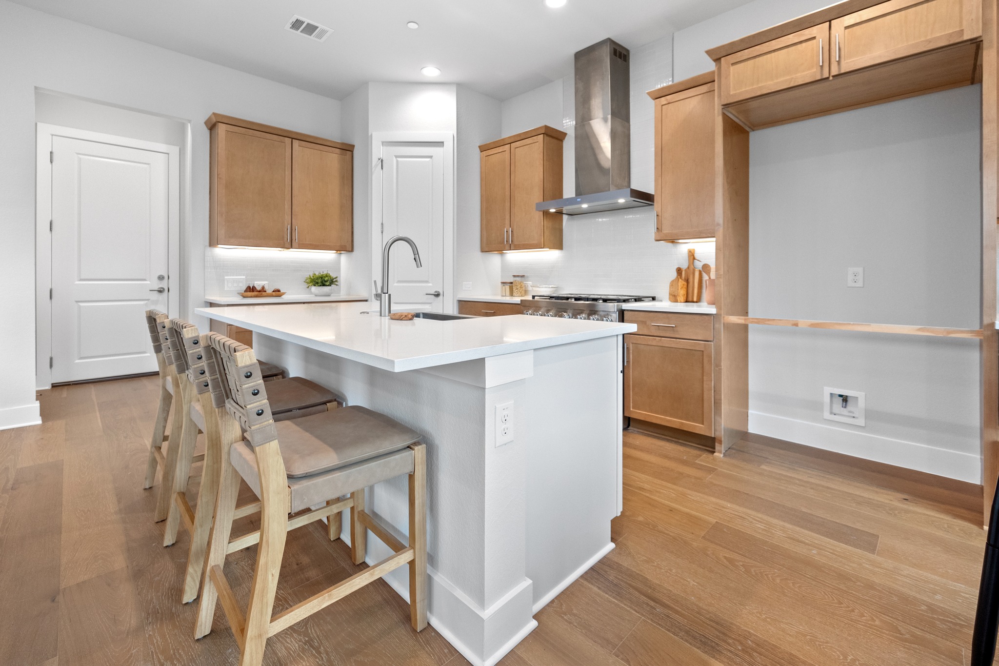 2707 Dulce Lane, Unit 14 Austin, TX 78704 - Photo 10 of 40 a kitchen with a sink cabinets and wooden floor