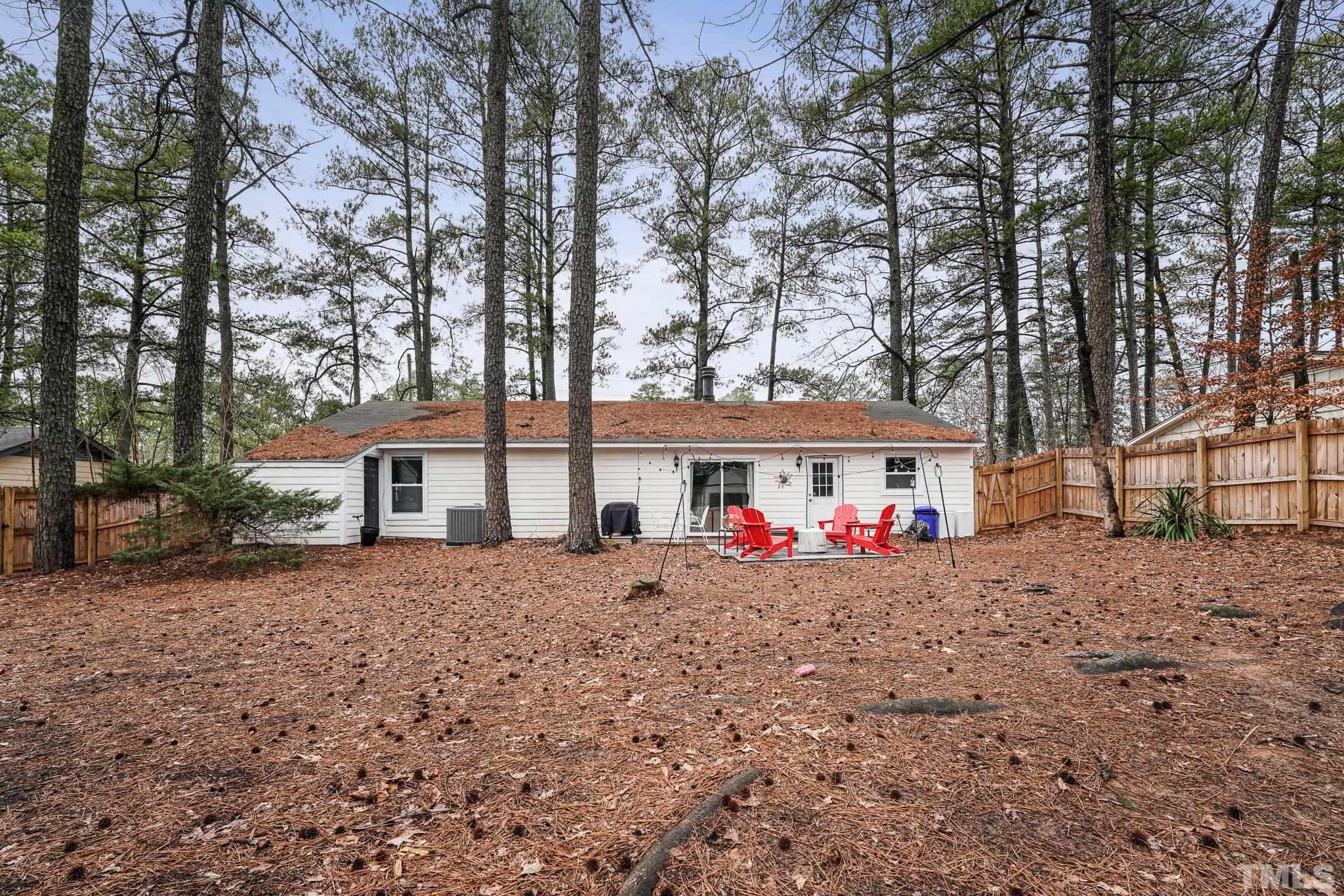 5218 Duraleigh Road Raleigh, NC 27612 - Photo 21 of 27 a front view of a house with a yard and garage
