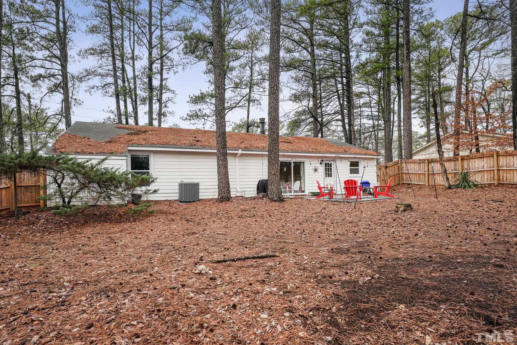 5218 Duraleigh Road Raleigh, NC 27612 - Photo 22 of 27 a front view of a house with a yard