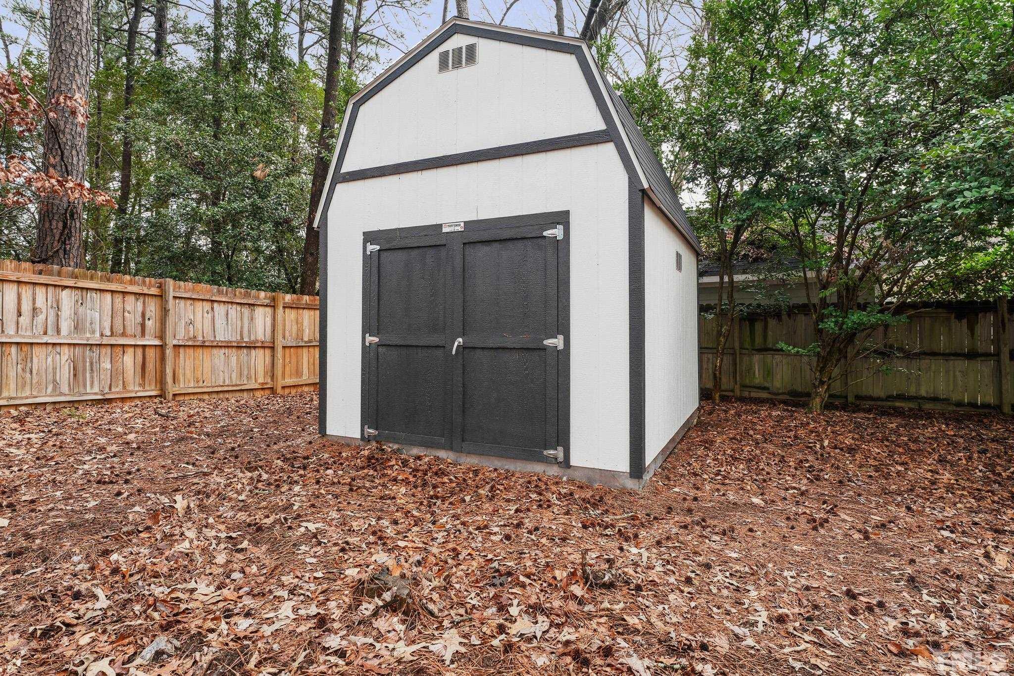 5218 Duraleigh Road Raleigh, NC 27612 - Photo 26 of 27 a backyard of a house